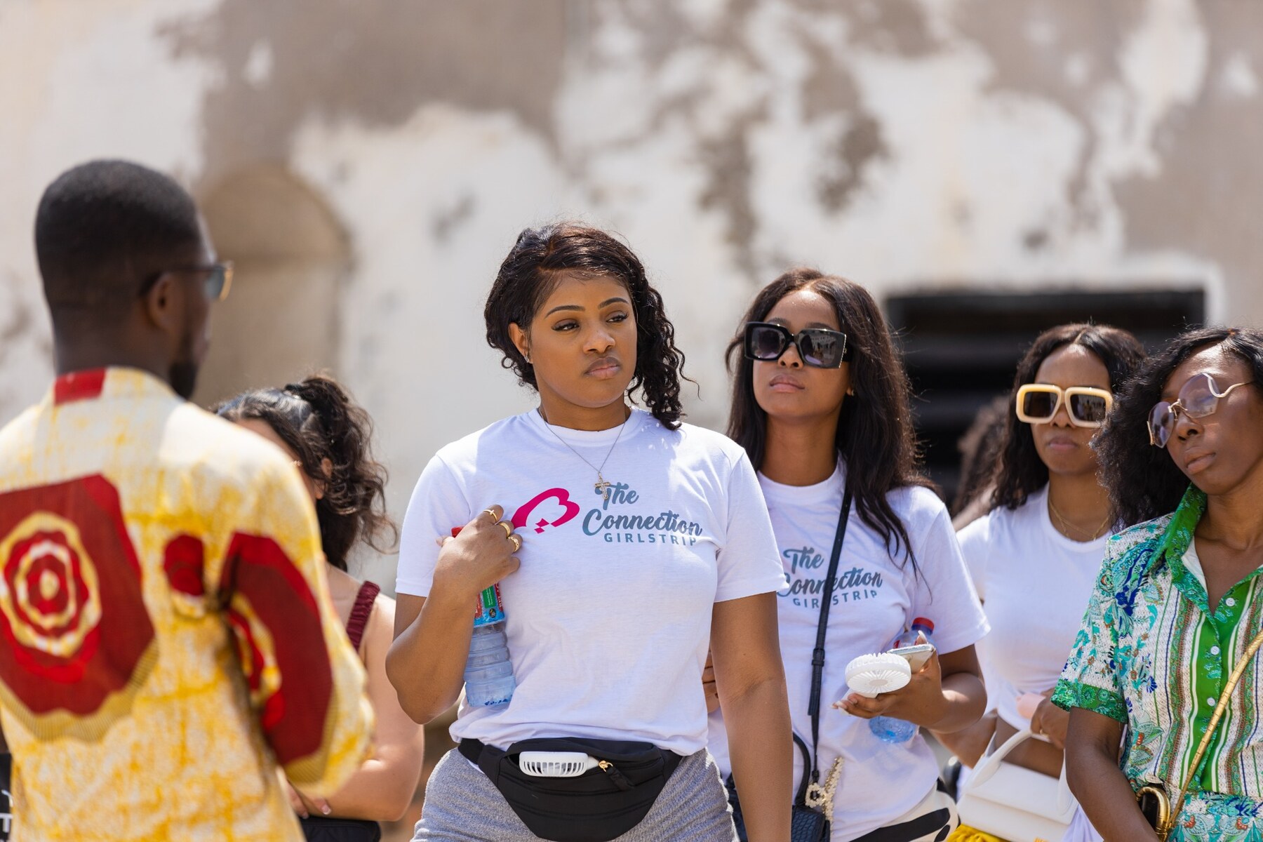 Guests gathered around a local guide during a cultural tour
