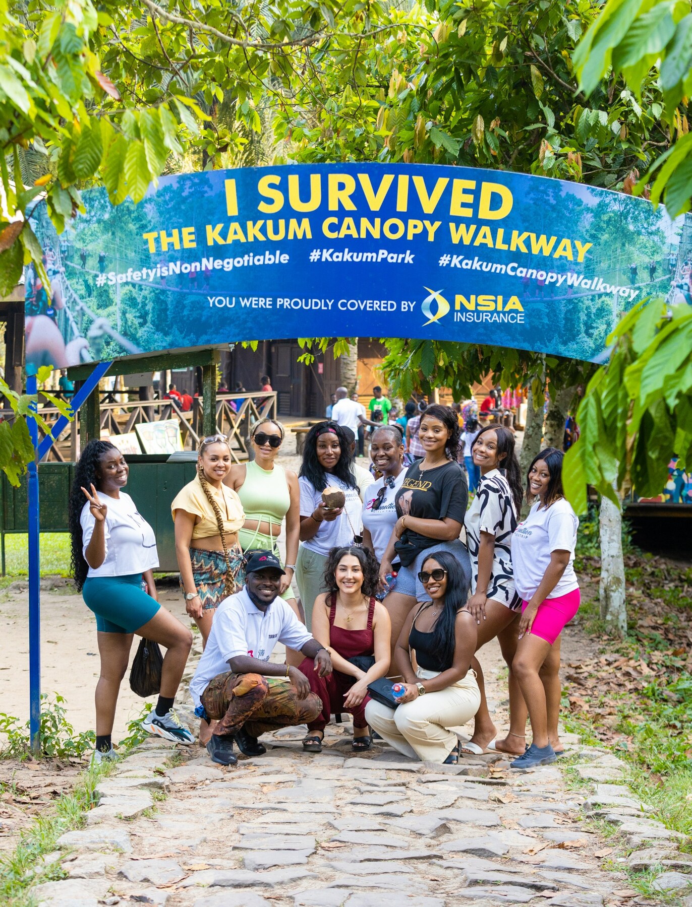 A group of guests celebrating after completing the Kakum canopy walkway