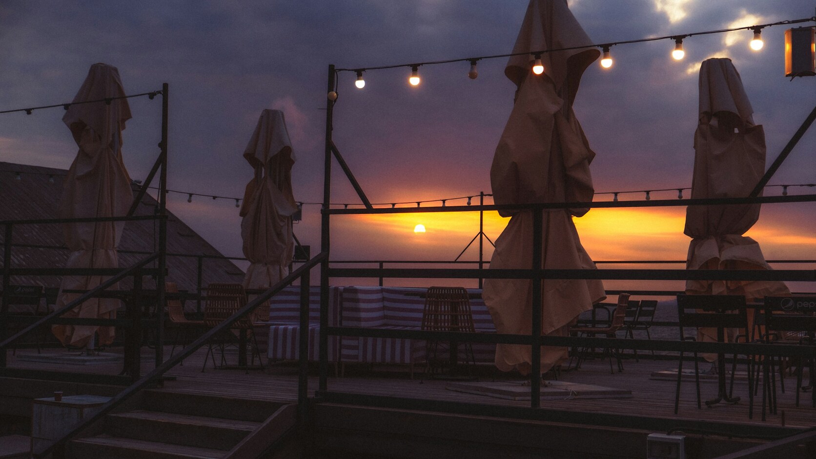 A refined rooftop terrace at sunset
